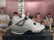 Side profile of a white high-top sneaker with speckled grey side support, mesh panel and dark blue outsole accents.