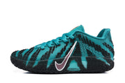Side profile of a teal basketball sneaker with black patterned detailing, contrasting swoosh and textured outsole.