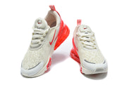 Front view of a pair of white and red Nike Air Max 270 Premium sneakers