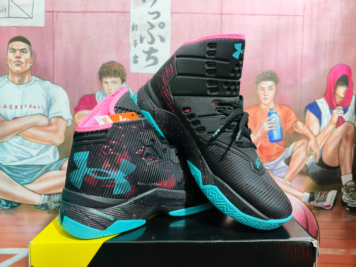 Pair of black Under Armour high-top basketball sneakers with pink trim and blue outsole accents shown on a shoebox.