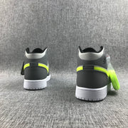 Rear view of the pair showing charcoal heel panels, light-grey collars, fluorescent accents and white outsoles.
