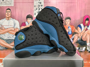 Pair of black and blue Jordan sneakers shown from the side