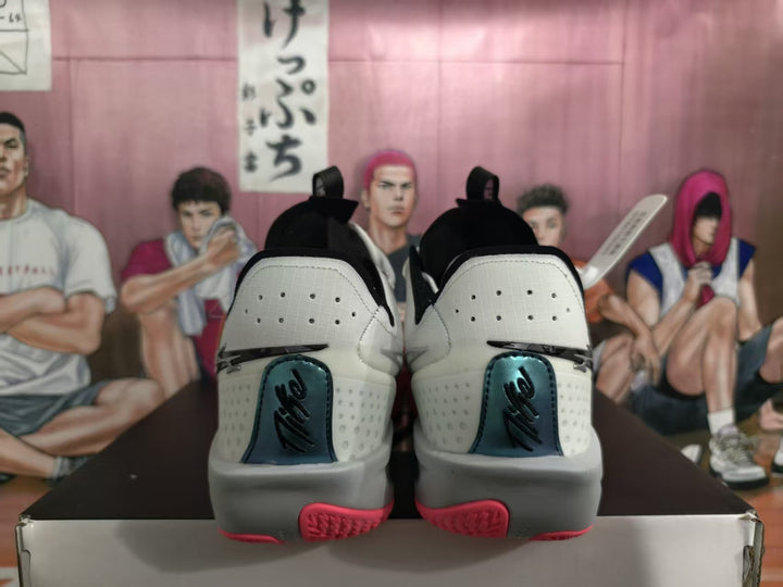 Rear view of white and pink Nike basketball sneakers positioned on a shoebox.