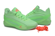 Fluorescent green pair shown in a three-quarter view with mesh panels and coral accents.