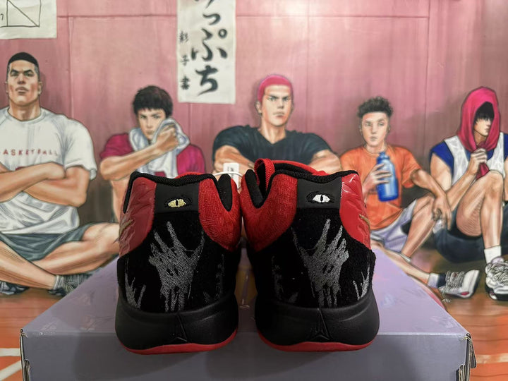 Rear view of red and black Nike basketball shoes with embroidered heel details