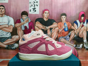 Side profile of a pink and burgundy low-top adidas sneaker with contrasting panels