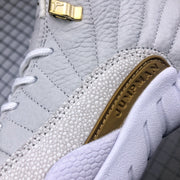 Detailed close-up of the textured side overlay, stitching, and gold-tone side branding.