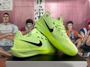 Pair of vivid green basketball shoes shown from the side, with black Swoosh logos and textured soles.