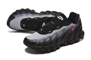 Angled side and top views of black and grey Nike Air Max DN8 sneakers.