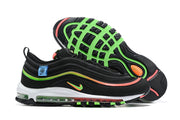 Side view of the black Nike Air Max 97 and its outsole, showing green and coral accents and the visible cushioning unit.