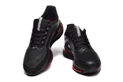 Front view of black Nike Pegasus Premium lace-up shoes with mesh-look toe panels.