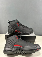 Black and red high-top sneakers shown from the side and outsole angles on a shoebox.