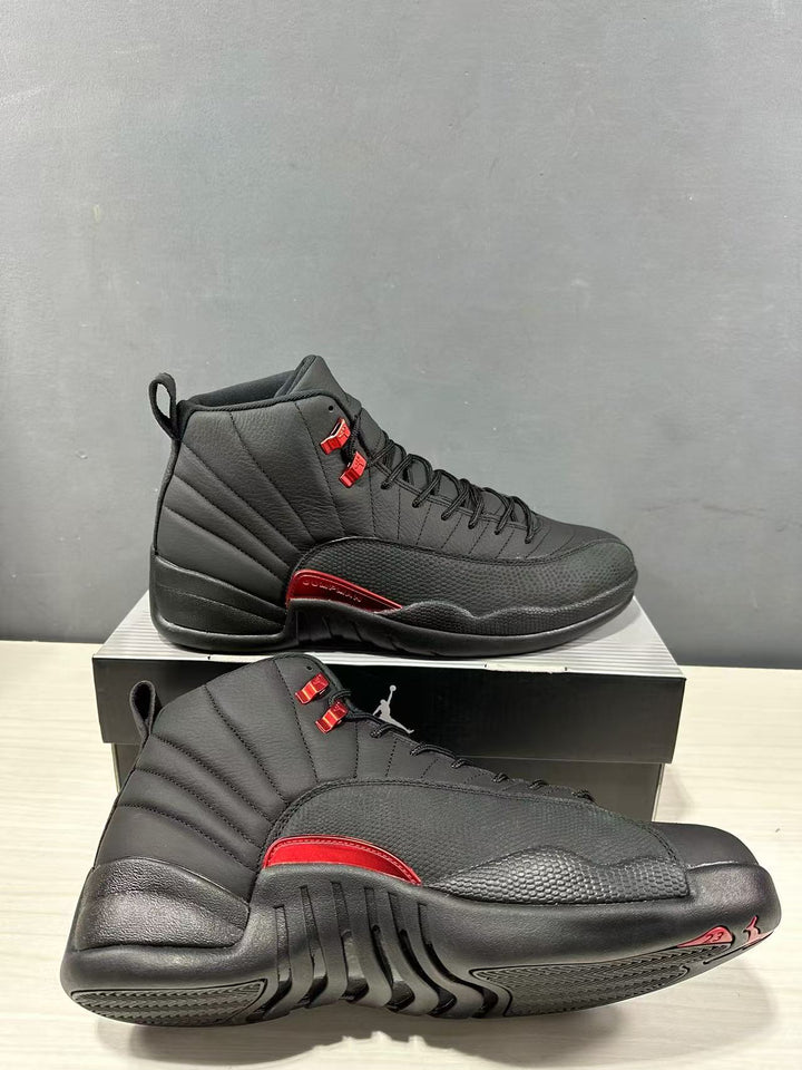 Black and red high-top sneakers shown from the side and outsole angles on a shoebox.