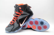 Nike high-top basketball sneaker shown from the front and underside, highlighting the patterned upper and segmented translucent outsole.