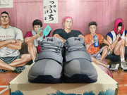 Front view of gray Nike basketball shoes with laces and wide forefoot straps