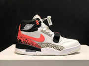 Side view of the sneaker showing the black Jordan collar, white upper, coral side detail, patterned overlay, and heel air unit.