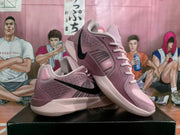 Pink and black Nike basketball shoes displayed at an angle