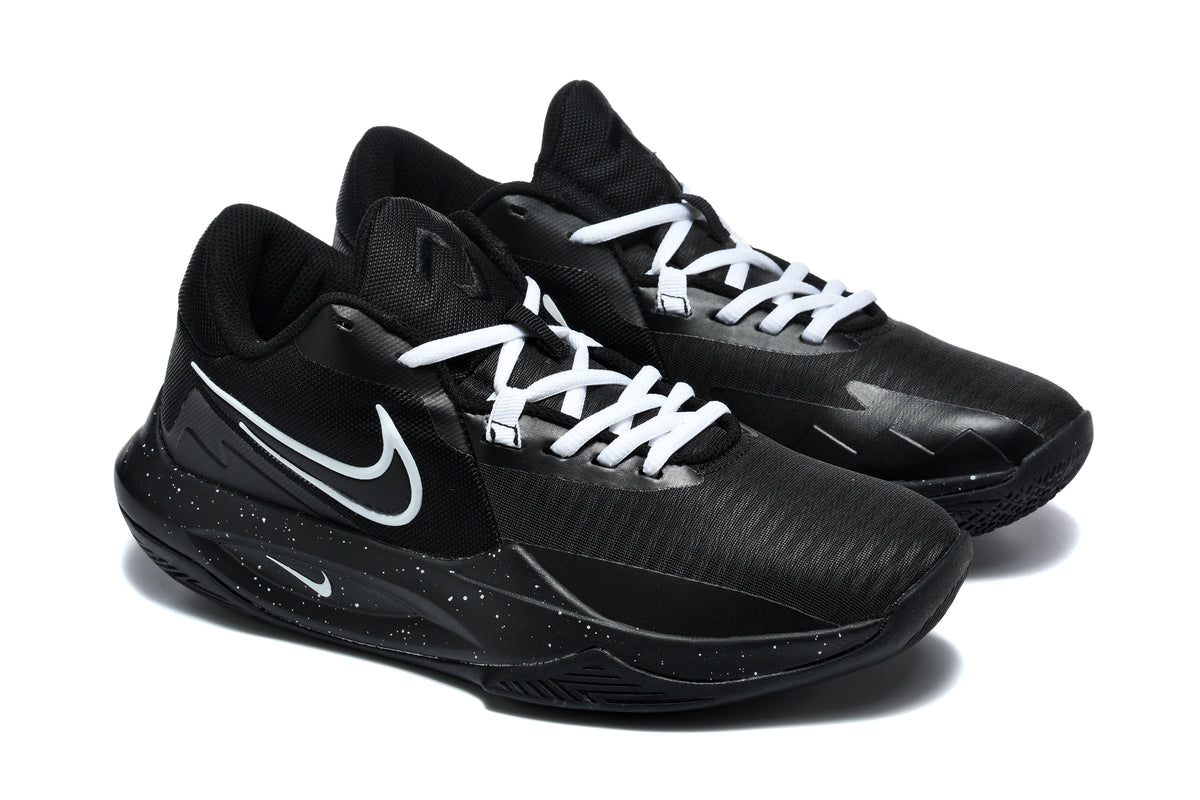 Pair of black Nike basketball sneakers with white laces, white Swoosh details, and speckled midsoles shown from a three-quarter angle.