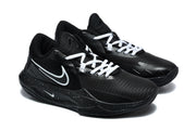 Pair of black Nike basketball sneakers with white laces, white Swoosh details, and speckled midsoles shown from a three-quarter angle.