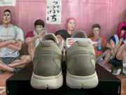Rear view of the pair showing padded collars, translucent-style heel panels, and segmented white outsoles.