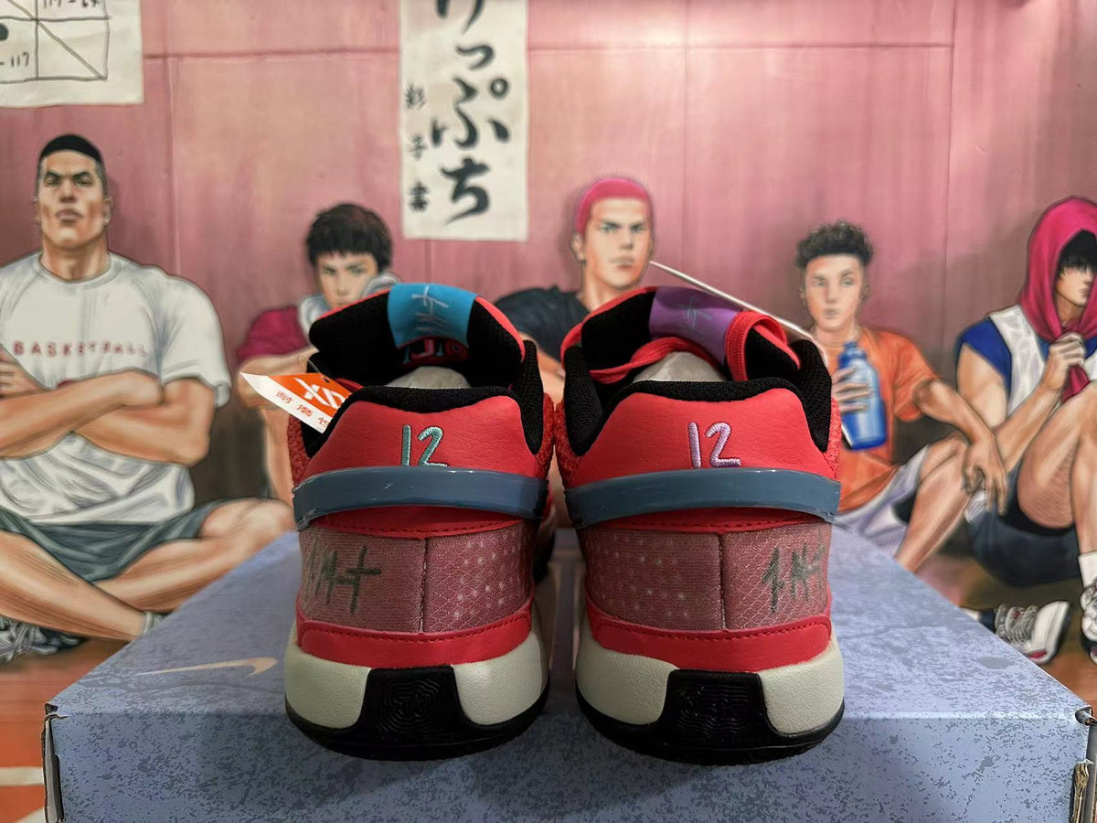 Rear view of red Nike basketball shoes showing number 12 embroidery and contrasting heel details.