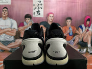 Rear view of black and white Nike Kobe sneakers showing KOBE and VI heel markings.