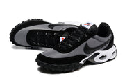 Pair of black and grey sneakers in a three-quarter view.