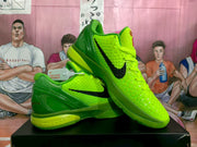 Pair of bright green Nike KD basketball sneakers shown from a three-quarter angle with black Swoosh details.