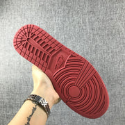 Close-up of the red outsole tread on an Air Jordan 1 sneaker