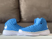 Pair of blue high-top sneakers arranged side by side, showing their padded collars.