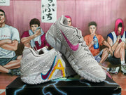 Angled view of light pink basketball shoes with multicolor side graphics