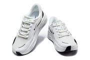 Front and top views of white Nike lace-up sneakers