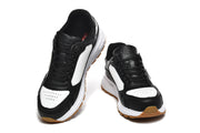 Pair of black and white low-top sneakers shown from the front