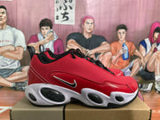Side view highlighting the red textured upper, contrasting Nike Swoosh, and rounded midsole openings.