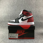 Air Jordan 1 high-top sneaker displayed on a shoe box with a visible size label
