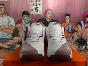 Front view showing the white laces, padded tongues, burgundy accents, and textured toe areas of the Nike sneakers.