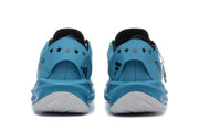 Rear view of blue shoes showing heel details and patterned outsoles