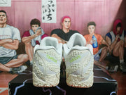 Rear view showing the textured heel panels and white construction of the Nike sneakers.