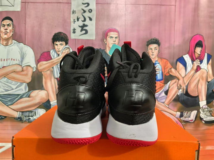 Rear view of black Nike basketball shoes with white midsoles and red outsoles.