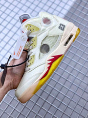 Close side view showing the number 23, translucent panels, red accents, yellow outsole, and midsole Air window.