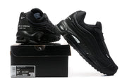 Black sneakers displayed with a shoebox; the label shows the pictured sample size and model information.