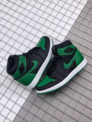 Top-down view of the pair showing the black and green color blocking and ankle emblems.