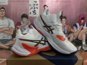 Angled view of white ASICS METARISE sneakers with orange accents, black outsole sections, and visible METARISE text.
