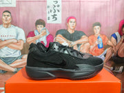 Side view of a black Nike basketball sneaker showing the Swoosh logo, textured upper, and thick outsole.