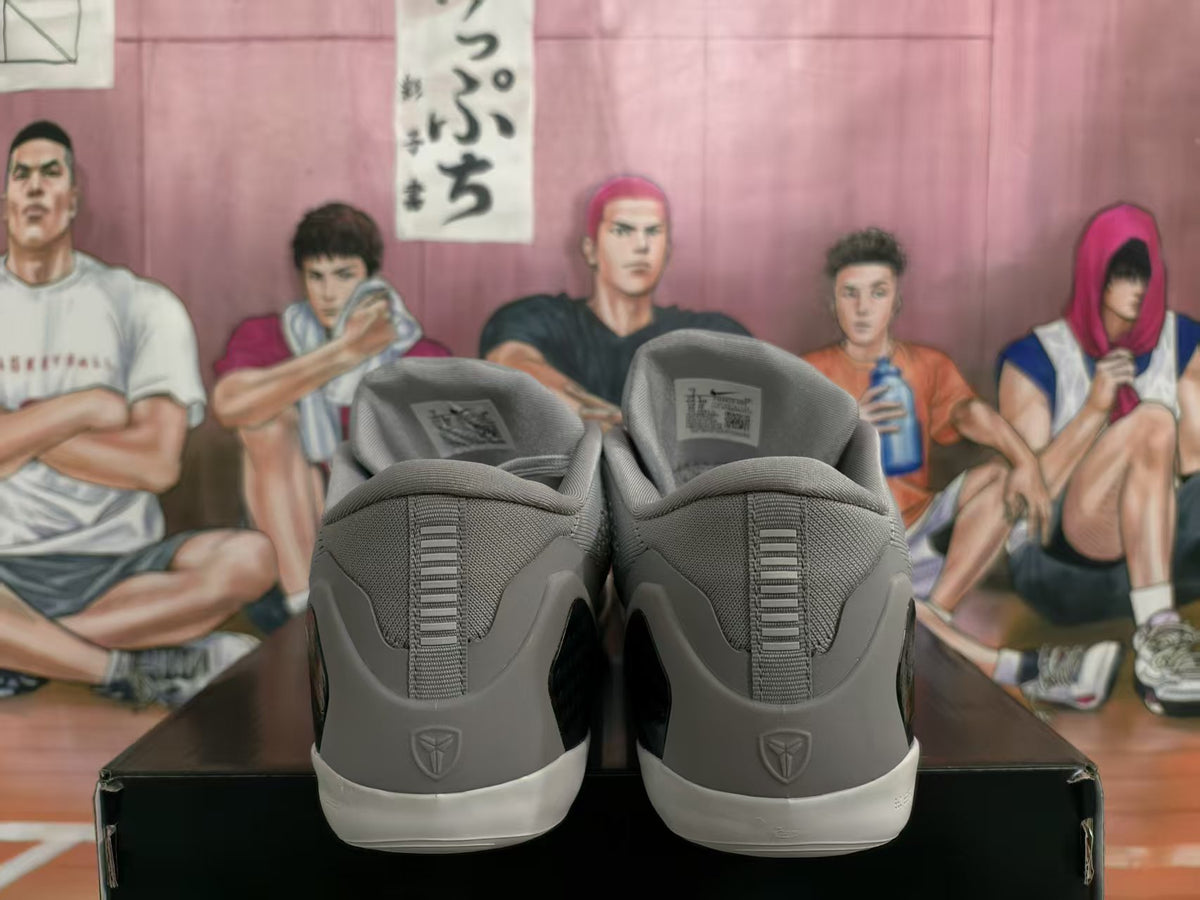 Rear view of grey Nike basketball shoes with white outsoles