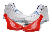 Pair of white high-top Jordan sneakers with light blue accents and outsole.