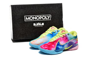 Multicolor shoes pictured beside a black box labeled Monopoly Brand and The LeBron James Edition.