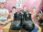 Front view of a pair of black ASICS Gelhoop basketball shoes.