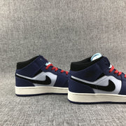 Pair of mid-top sneakers displayed from the side with red laces and white midsoles.