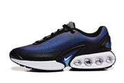 Side view of black and blue Nike sneakers with white heel cushioning pods